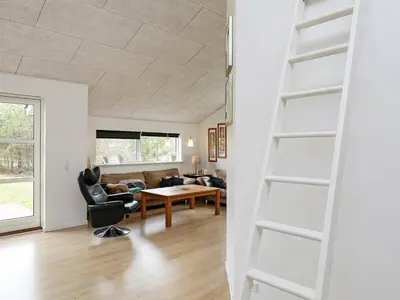 a living room with a couch and a table at 10 person holiday home in Løgstør-By Traum in Trend
