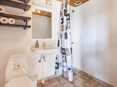 a bathroom with a toilet and a sink at 8 person holiday home in Vestervig in Vestervig