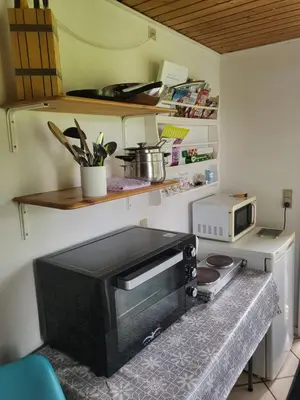 a microwave sitting on a counter in a kitchen at Astrup vig Spa og Sauna in Roslev
