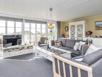 a living room with a couch and a table at 8 person holiday home in Løgstør-By Traum in Trend
