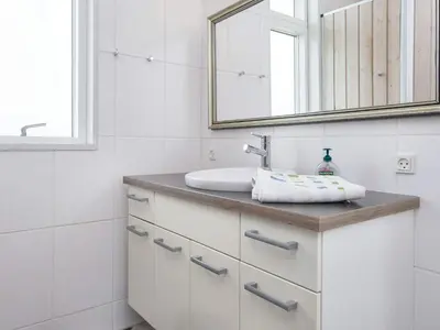 a bathroom with a sink and a mirror at 10 person holiday home in Harboøre-By Traum in Harboør