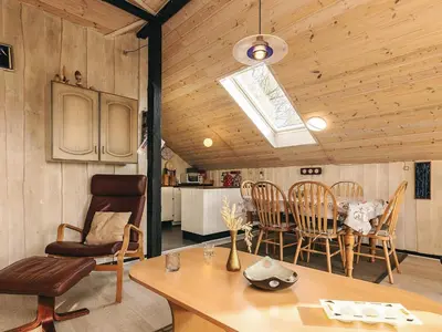 a kitchen and dining room with a table and chairs at 6 person holiday home in Roslev-By Traum in Vester Grønning