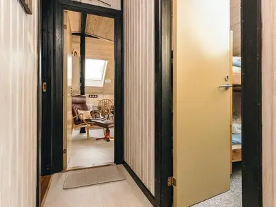 a hallway with a door leading into a room at 6 person holiday home in Roslev-By Traum in Vester Grønning