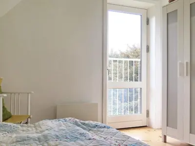 a bedroom with a bed and a large window at 5 person holiday home in Harboøre in Harboør