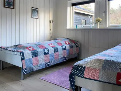 a bedroom with two beds in a room at 6 person holiday home in Spøttrup-By Traum in Knud