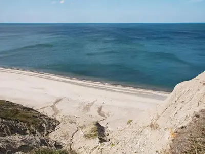 an empty beach with the ocean in the background at 4 person holiday home in Lemvig-By Traum in Trans
