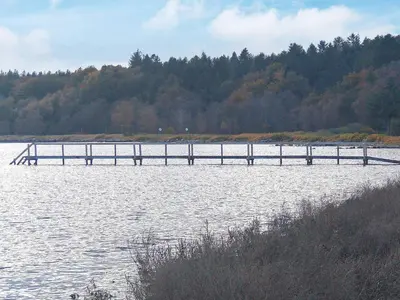 a dock in the middle of a body of water at 6 person holiday home in Øster Assels-By Traum in Sillerslev