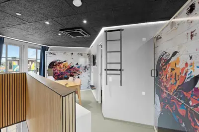 a room with a table and a painting on the wall at Funart 4 in Pandrup