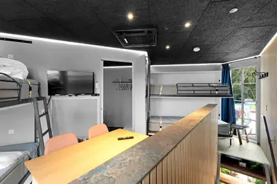 a room with a desk and bunk beds at Funart 8 in Pandrup
