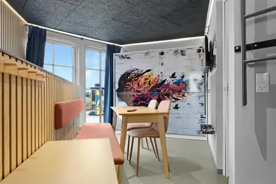 a dining room with a table and chairs at Funart 6 in Pandrup