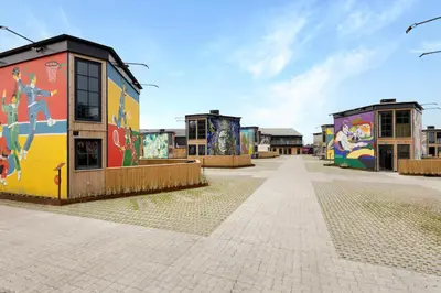 a group of buildings with graffiti on them at Funart 6 in Pandrup