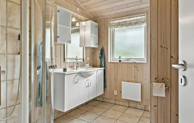 a bathroom with a sink and a shower at 2 Bedroom Cozy Home In Højslev in Højslev