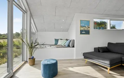 a living room with a couch and a table at Beautiful Home In Nykøbing M With Wifi in Alsted