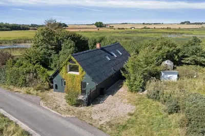 a small house on the side of a road at Spacious Holiday Home With Views Over Limfjorden in Jørsby
