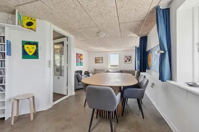 a dining room with a table and chairs at Spacious Holiday Home With Views Over Limfjorden in Jørsby