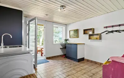 a bathroom with a sink and a washing machine at Lovely Home In Bøvlingbjerg With Wifi in Bøvlingbjerg