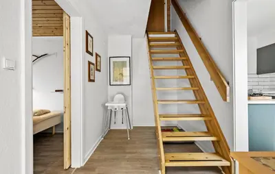 a staircase in a room with white walls and wooden floors at Lovely Home In Bøvlingbjerg With Wifi in Bøvlingbjerg