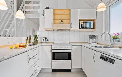 a white kitchen with white cabinets and a sink at Nice Home In Frøstrup With Kitchen in Frøstrup