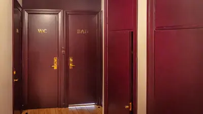 two wood doors with the words wc bar on them at Morup Mølle Kro in Bedsted Thy