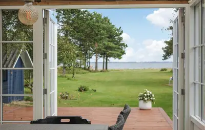 an open patio door with a view of a yard at 3 Bedroom Beautiful Home In Thyholm in Thyholm