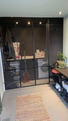 a room with a sliding glass door with a rug at Rækkehus tæt på skov, sø og by in Viborg