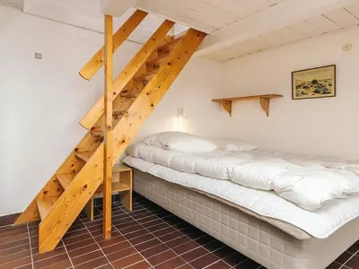 two beds in a room with a staircase at Panoramic View Fisherman's House - By Traum Ferienwohnungen in Vesløs