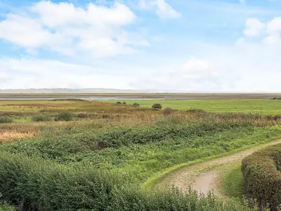 a dirt road in the middle of a field at Panoramic View Fisherman's House - By Traum Ferienwohnungen in Vesløs