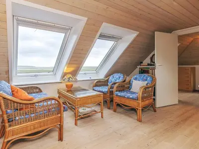 a living room with chairs and a table and two windows at Panoramic View Fisherman's House - By Traum Ferienwohnungen in Vesløs