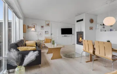 a living room with a couch and a table at 2 Bedroom Nice Home In Thisted in Thisted
