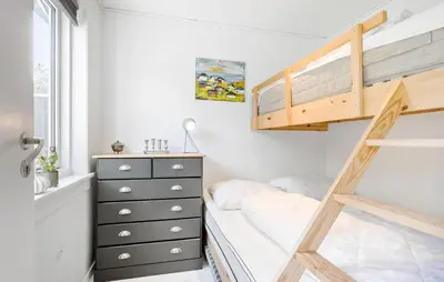 a bedroom with a bunk bed and a dresser at Pet Friendly Home In Spøttrup With Wifi in Spottrup