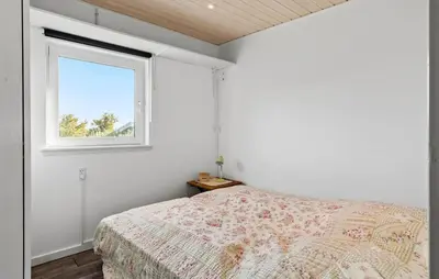 a bedroom with a bed and a window at 2 Bedroom Lovely Home In Thisted in Thisted