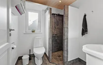 a bathroom with a shower and a toilet and a sink at 2 Bedroom Lovely Home In Thisted in Thisted