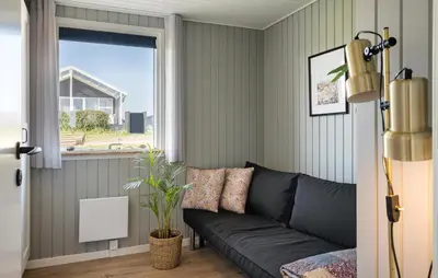 a living room with a couch and a window at Cozy Home In Lemvig With Wifi in Lemvig