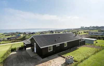 an aerial view of a house with a black roof at Cozy Home In Lemvig With Wifi in Lemvig