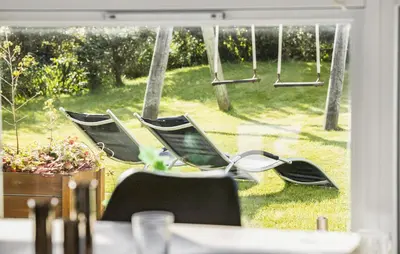 a group of chairs sitting in front of a window at Lovely Home In Blokhus With Wifi in Blokhus