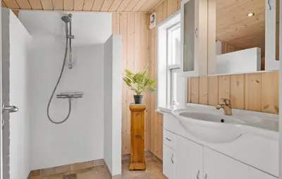 a bathroom with a shower and a sink at Lovely Home In Blokhus With Wifi in Blokhus