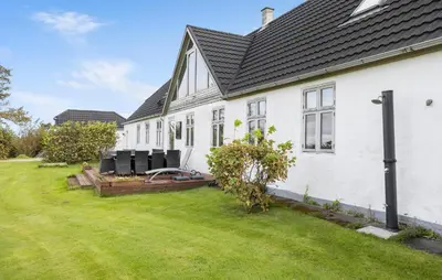 a white house with a large yard at 4 Bedroom Gorgeous Home In Vestervig in Vestervig
