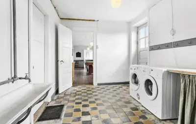 a white laundry room with a washer and dryer at 4 Bedroom Gorgeous Home In Vestervig in Vestervig
