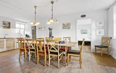 a dining room and kitchen with a table and chairs at 4 Bedroom Gorgeous Home In Vestervig in Vestervig