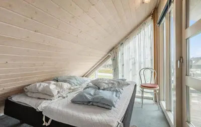 two beds in a room with a window at Pet Friendly Home In Thisted With Sauna in Thisted
