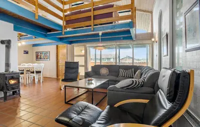 a living room with a couch and a table at Pet Friendly Home In Thisted With Sauna in Thisted