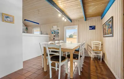 a kitchen and dining room with a table and chairs at Pet Friendly Home In Thisted With Sauna in Thisted