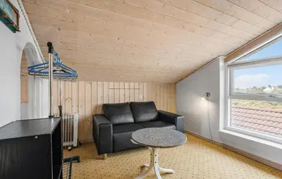 a living room with a couch and a table at Pet Friendly Home In Thisted With Sauna in Thisted