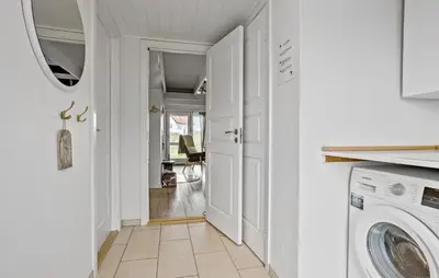 a white laundry room with a washer and dryer at Awesome Home In Thisted With Sauna in Thisted