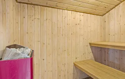 a inside of a wooden sauna with a trash can at Awesome Home In Thisted With Sauna in Thisted