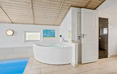 a large bathroom with a tub in a room at Awesome Home In Thisted With Sauna in Thisted