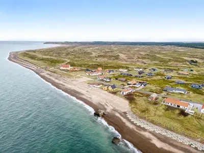 an aerial view of a beach with a group of tents at Pool And Activity House With A 180-Degree View Of The North Sea, Located At Lild Strand in Frøstrup