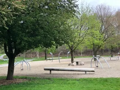 a park with benches and slides in a park at Struer Festcenter - Vest Bowl lejlighed 1 Bredgade 62 C in Struer