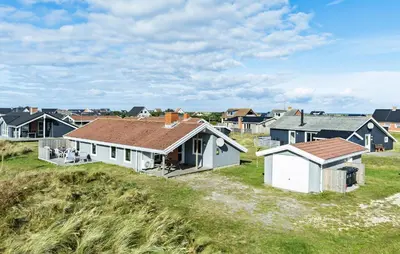 a group of houses on a grassy field at Pet Friendly Home In Thisted With Sauna in Thisted