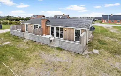 a house sitting on top of a grass field at Beautiful Home In Thisted in Thisted